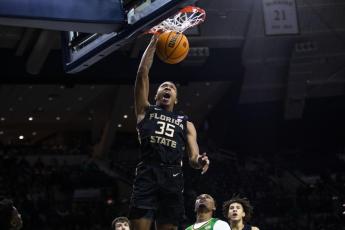 Florida State's Matthew Cleveland dunks against Notre Dame on Tuesday in South Bend, Ind. (MICHAEL CATERINA/Associated Press)