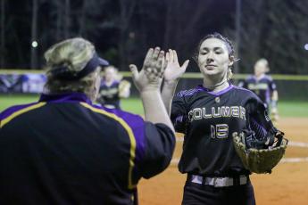 Columbia pitcher Madelyn Jones high-fives head coach Cindy Dansby as she walks back to the dugout following an inning against Bradford on Monday night. (BRENT KUYKENDALL/Lake City Reporter)