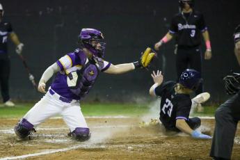 Kolt Myers slides into home plate safely, beating a tag from Columbia catcher Hayden Gustavson on Wednesday night. (BRENT KUYKENDALL/Lake City Reporter)