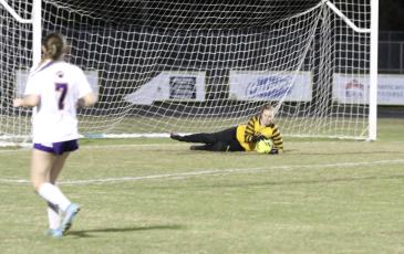 Columbia goalkeeper Haley Schrader makes a save against Lecanto during the Region 1-5A quarterfinal on Tuesday. (MORGAN MCMULLEN/Lake City Reporter)