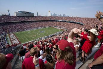 Oklahoma and Texas fans cheer at the Cotton Bowl on Oct. 8, 2022, in Dallas. (JEFFREY MCWHORTER/Associated Press)