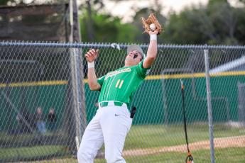 Suwannee third baseman Logan Brooks catches a pop up against Columbia on March 28. (BRENT KUYKENDALL/Lake City Reporter)