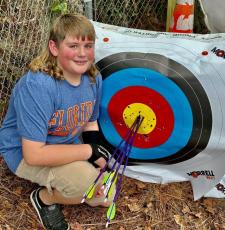 Richardson Sixth Grade Academy student Chase Bryant is returning to the National Archery in the Schools Program national championship. (COURTESY)