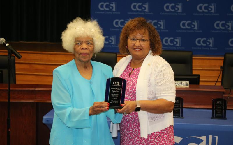 Bettye Lane was named a ‘Teacher of a Lifetime’ award winner by school board chair Narrie Smith. (TONY BRITT/Lake City Reporter)