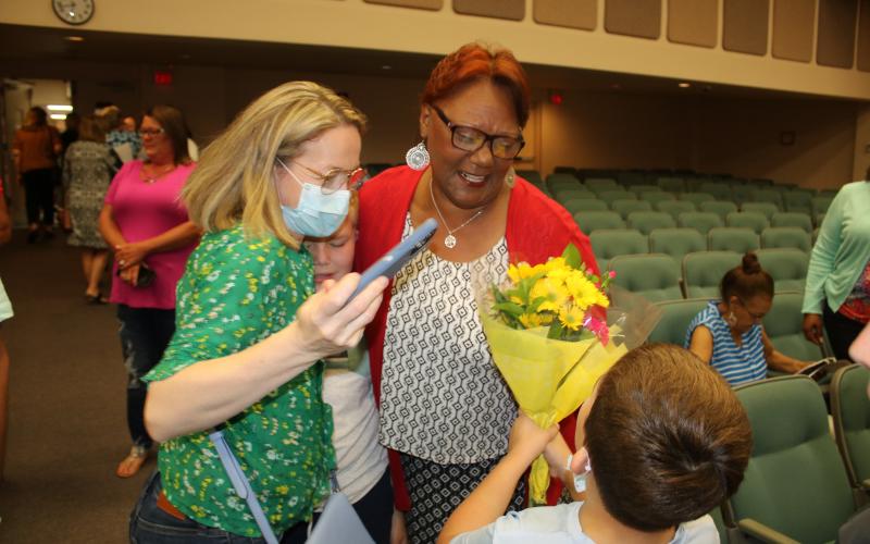 Westside Elementary school kindergarten teacher Argie Crusaw is congratulated after being honored as one of the Columbia County School District’s inaugural ‘Teacher of a Lifetime’ award winners Tuesday night. (TONY BRITT/Lake City Reporter)