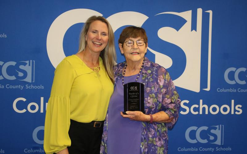 Lenora Steadman received her ‘Teacher of a Lifetime’ award from school board member Dana Brady Giddens. (TONY BRITT/Lake City Reporter)