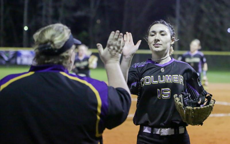 Columbia pitcher Madelyn Jones high-fives head coach Cindy Dansby as she walks back to the dugout following an inning against Bradford on Monday night. (BRENT KUYKENDALL/Lake City Reporter)