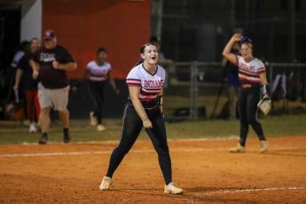 Fort White pitcher Kadence Compton celebrates after finishing her complete-game victory over Madison County on Thursday in the Region 3-1A semifinals. (BRENT KUYKENDALL/Lake City Reporter)