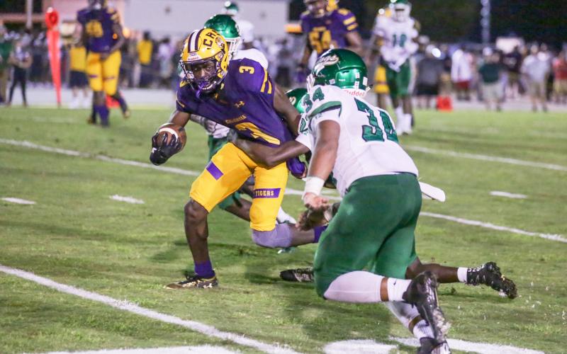 Columbia receiver TJ Jones tries to escape a tackle against Suwannee on Aug. 31, 2018. (BRENT KUYKENDALL/Lake City Reporter)