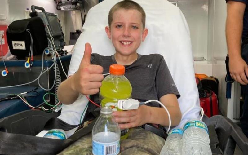 Scott Koehn gives a thumbs up after first responders found him Saturday afternoon in a thicket of trees in western Suwannee County. The 12-year-old had been missing for two days. (COURTESY SUWANNEE COUNTY SHERIFF'S OFFICE)