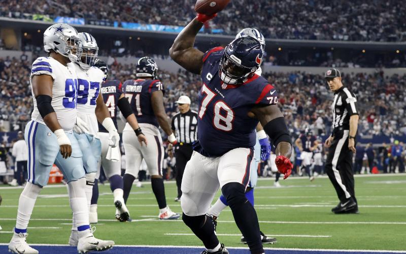 Houston Texans offensive tackle Laremy Tunsil (78) spikes the football after following his team’s touchdown against the Dallas Cowboys at AT&T Stadium on Dec. 11, 2022, in Arlington, Tex. (TOM FOX/TNS)